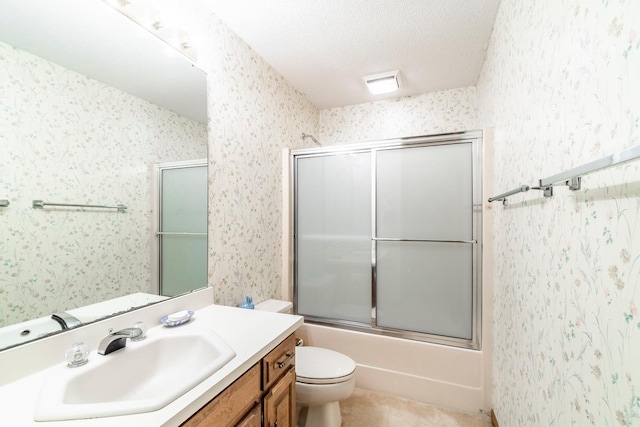 4980 N 300 W, Fremont, IN 46737 - full bathroom with bath / shower combo with glass door, vanity, a textured ceiling, and toilet