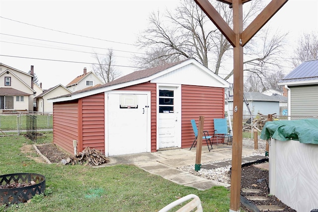 view of outbuilding with a lawn