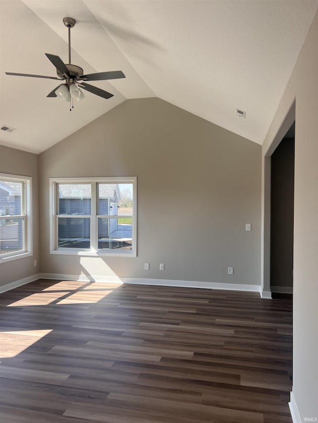 unfurnished room featuring visible vents, dark wood finished floors, and baseboards