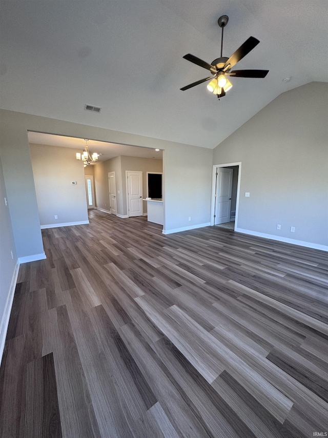 unfurnished living room with baseboards, visible vents, dark wood-style floors, and vaulted ceiling
