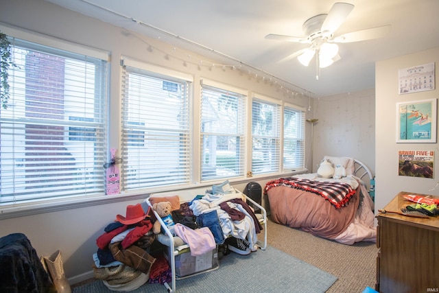 carpeted bedroom featuring ceiling fan