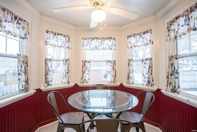 dining space with ornamental molding