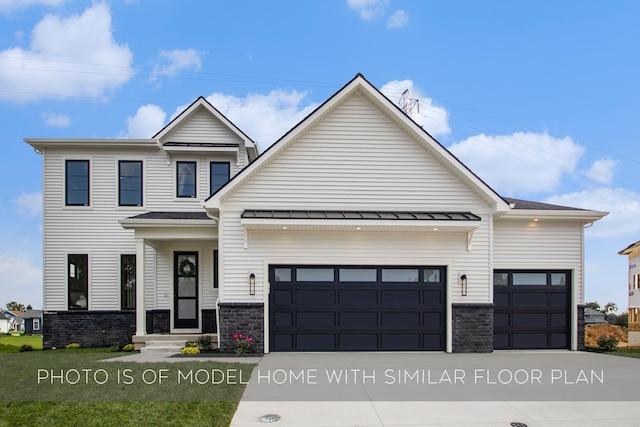 view of front of house featuring a garage, a standing seam roof, driveway, and stone siding