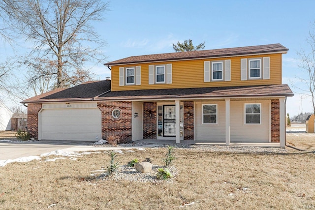 view of front property with a garage and a porch