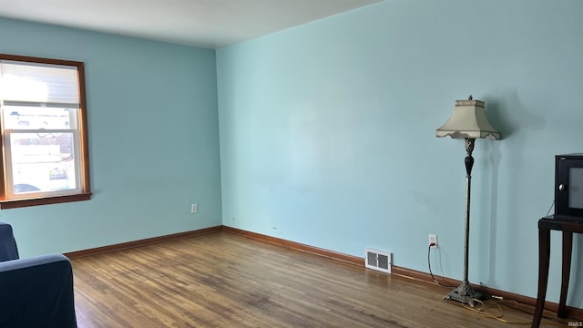 spare room with hardwood / wood-style flooring