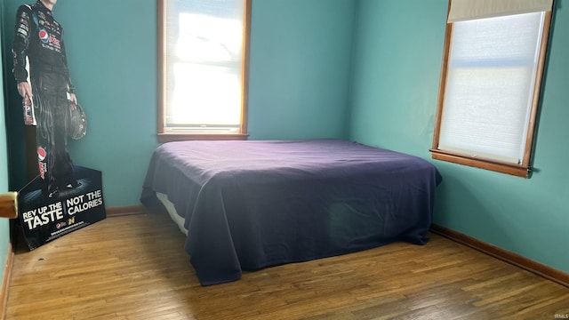 bedroom with hardwood / wood-style flooring