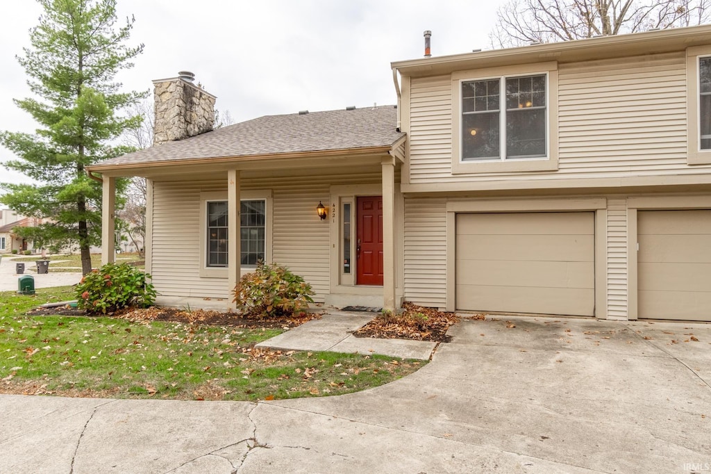 view of front of home with a garage and a front yard