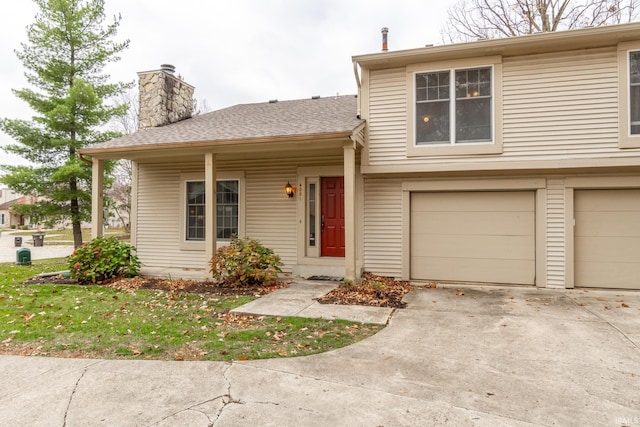 view of front of home with a garage and a front yard