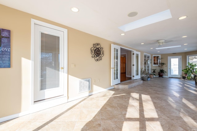 interior space featuring ceiling fan