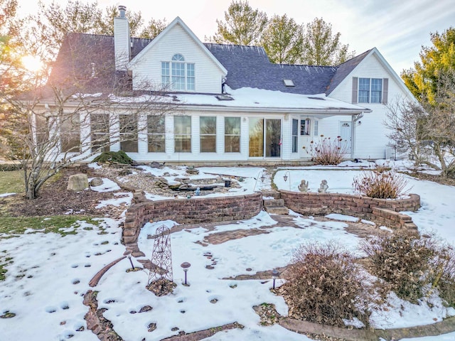 view of snow covered house