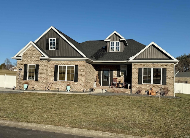 craftsman-style home featuring a front lawn