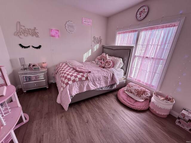 bedroom featuring wood-type flooring