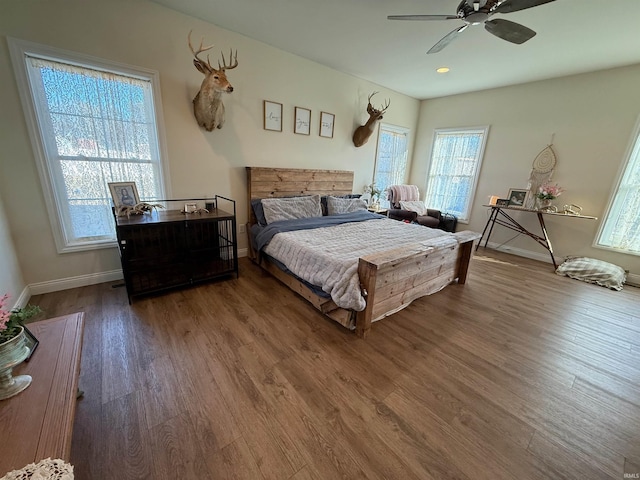 bedroom with hardwood / wood-style flooring and ceiling fan