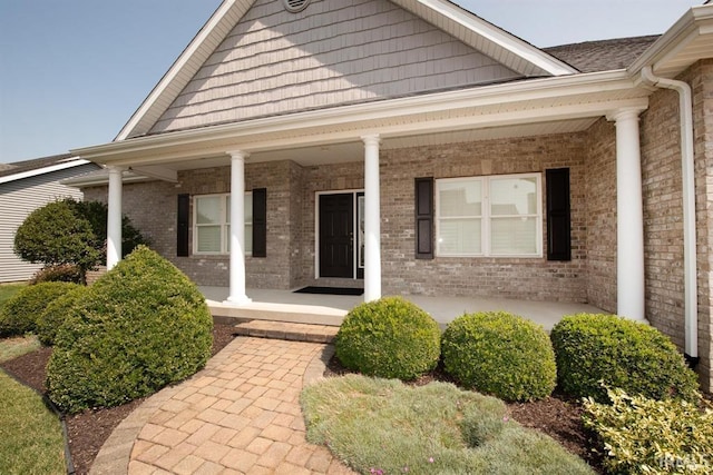 entrance to property featuring a porch