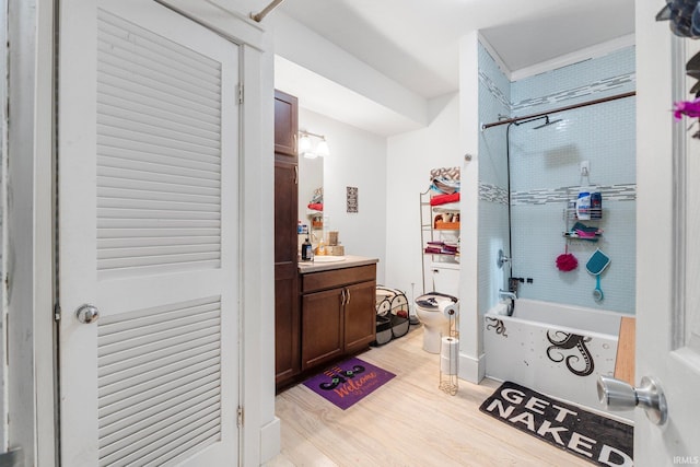 full bathroom featuring vanity, tub / shower combination, wood-type flooring, and toilet