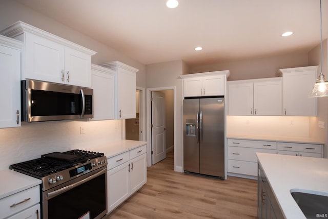 kitchen featuring white cabinetry and stainless steel appliances