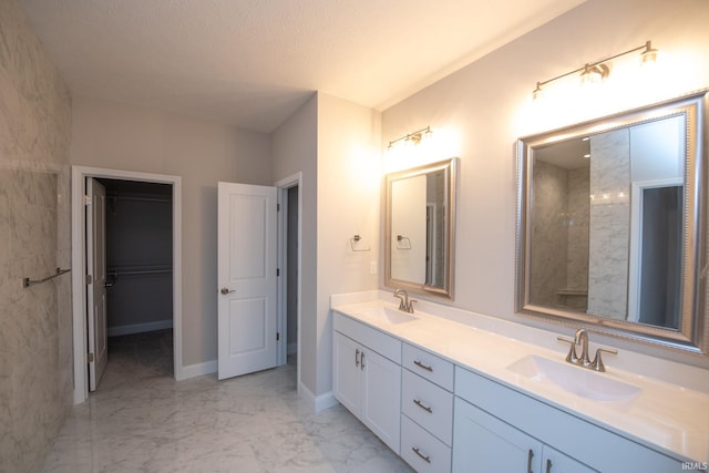 bathroom featuring vanity and a textured ceiling