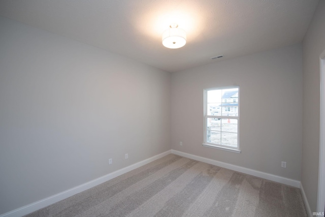 spare room featuring carpet flooring