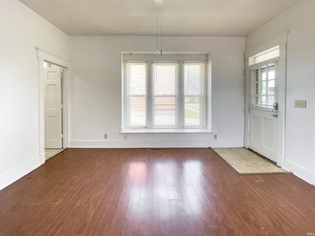 unfurnished dining area featuring hardwood / wood-style flooring and a healthy amount of sunlight