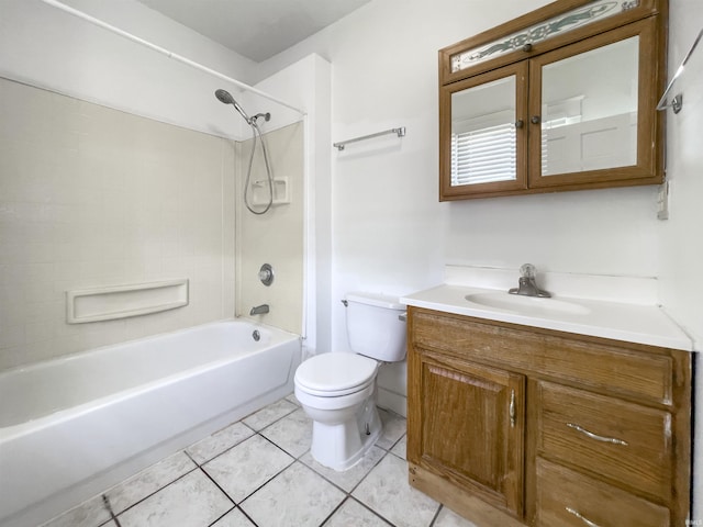 full bathroom featuring vanity, tiled shower / bath, tile patterned floors, and toilet