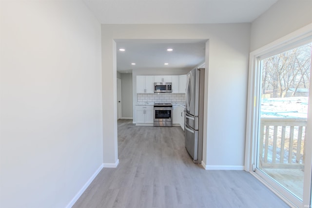 hallway featuring light wood-type flooring