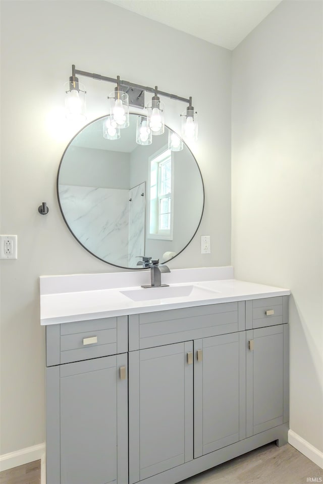 bathroom featuring vanity and hardwood / wood-style floors