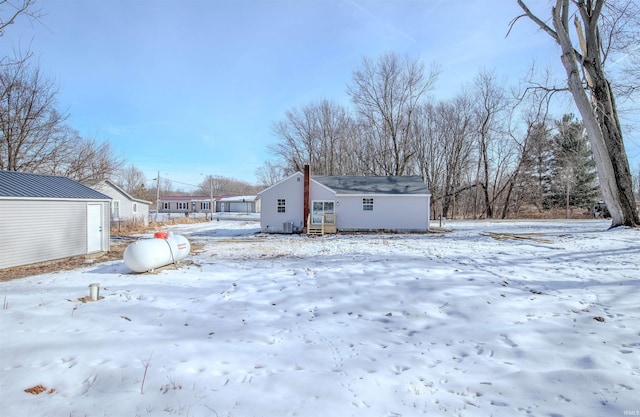 view of snow covered house