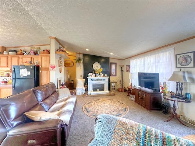 living room featuring crown molding, carpet flooring, and a textured ceiling