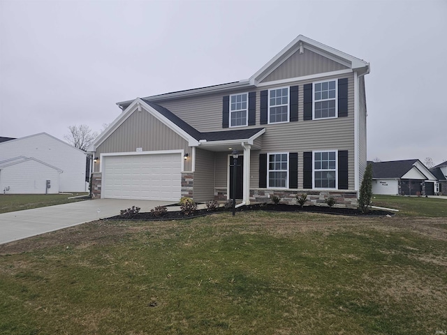 view of front of home with a garage and a front yard