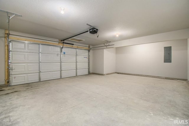 garage featuring a garage door opener and electric panel