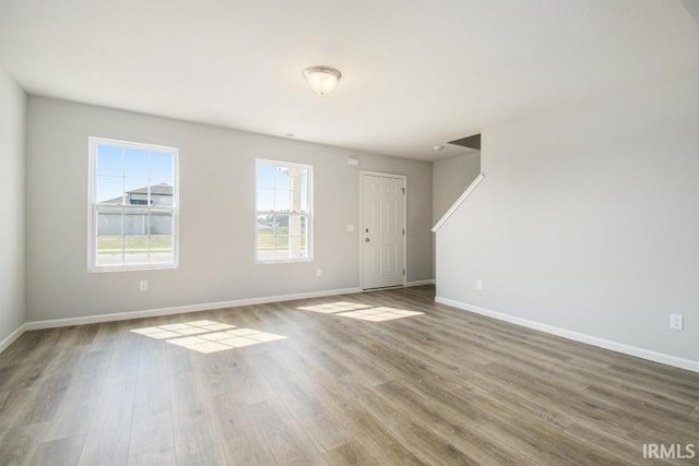 spare room with wood-type flooring