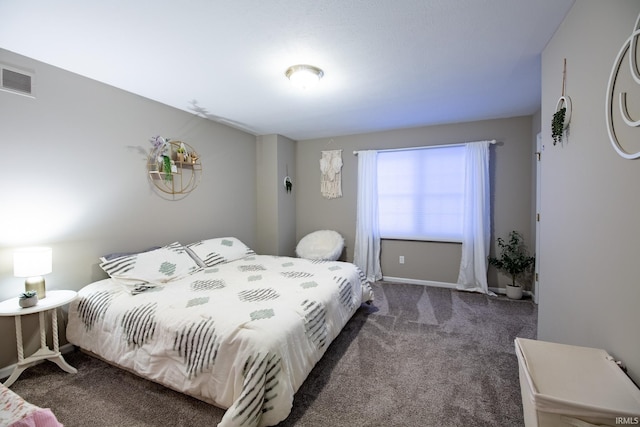 bedroom featuring dark carpet