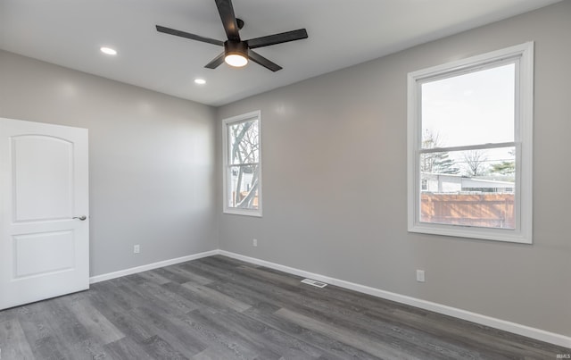 unfurnished room featuring dark hardwood / wood-style flooring and ceiling fan