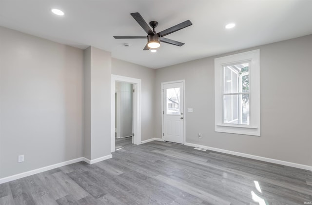 interior space featuring ceiling fan and light wood-type flooring