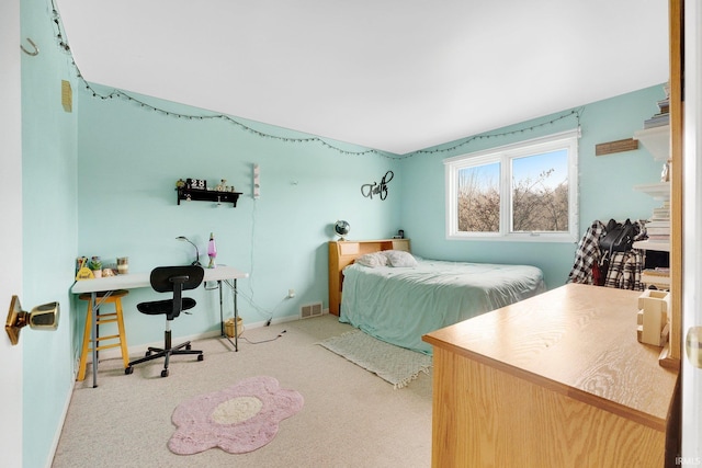 bedroom with light colored carpet