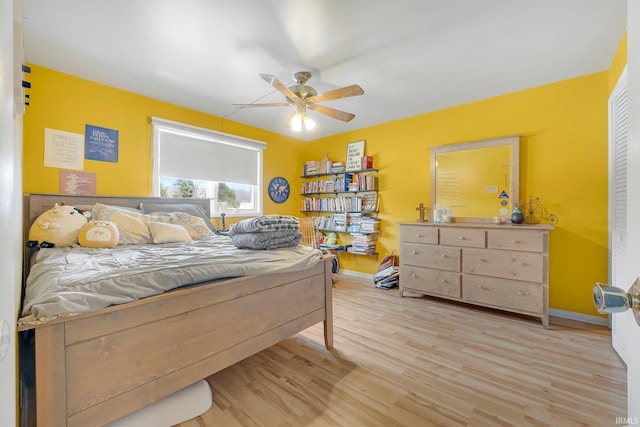 bedroom featuring ceiling fan and light wood-type flooring