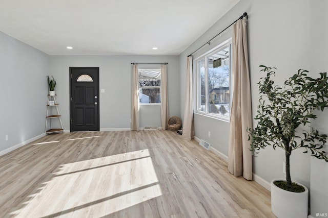 foyer with light hardwood / wood-style floors