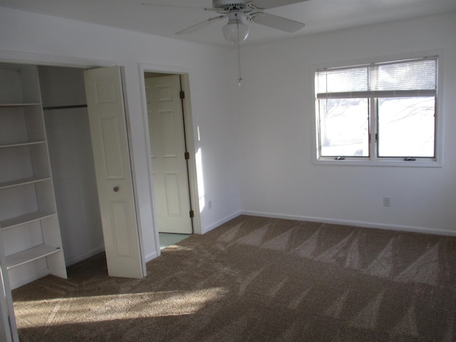 unfurnished bedroom with ceiling fan and carpet