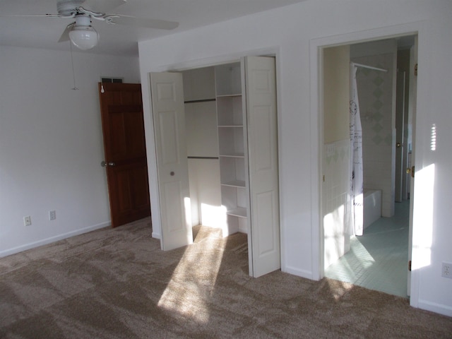 unfurnished bedroom with ceiling fan and carpet floors