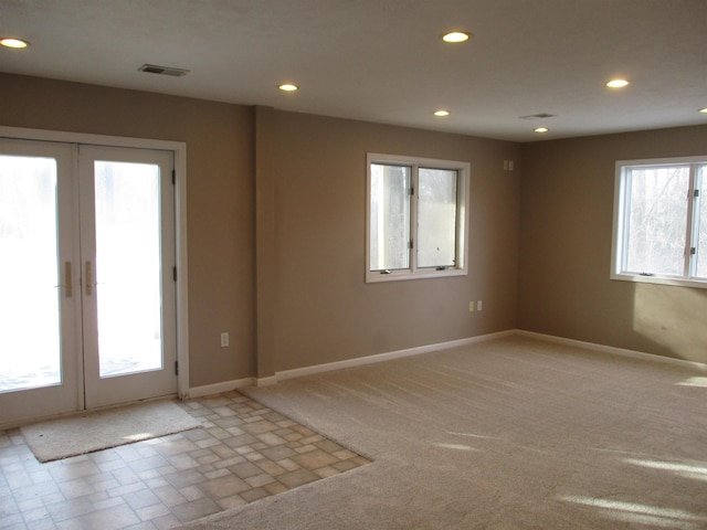 unfurnished room with french doors