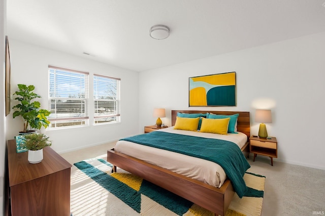 bedroom featuring light colored carpet