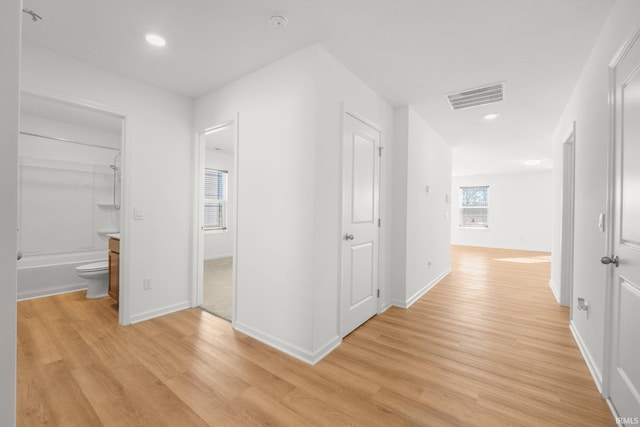 corridor featuring light hardwood / wood-style floors