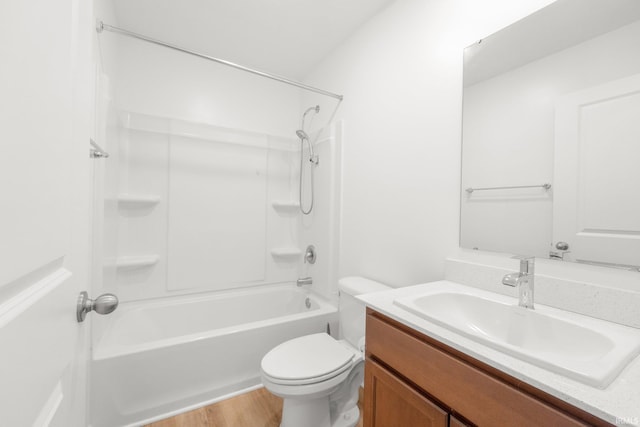 full bathroom featuring wood-type flooring, toilet, tub / shower combination, and vanity