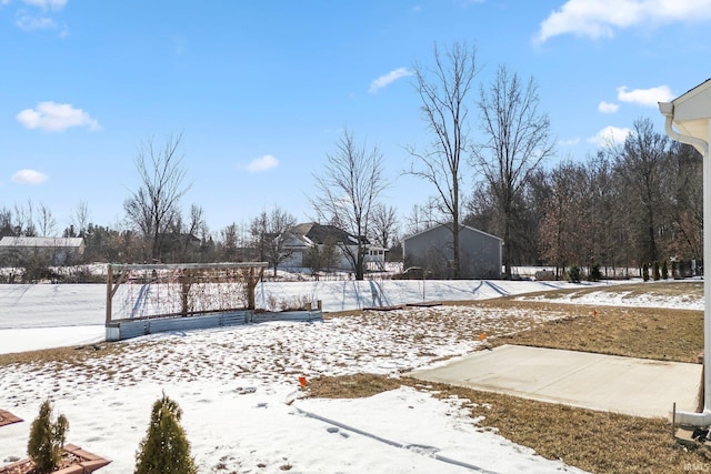 view of yard layered in snow