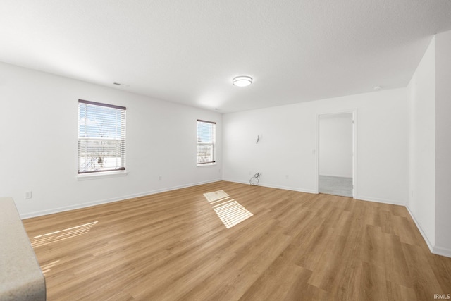 spare room featuring light wood-type flooring