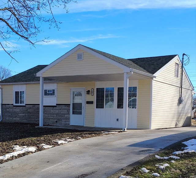 view of front of property with a carport