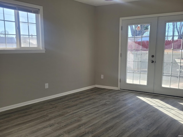 unfurnished room with dark hardwood / wood-style flooring and french doors