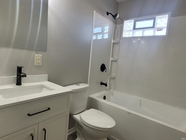 full bathroom with vanity, washtub / shower combination, and toilet