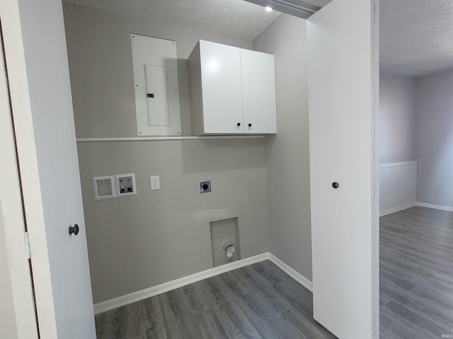 laundry room with cabinets, electric panel, hookup for a washing machine, hookup for an electric dryer, and hardwood / wood-style floors