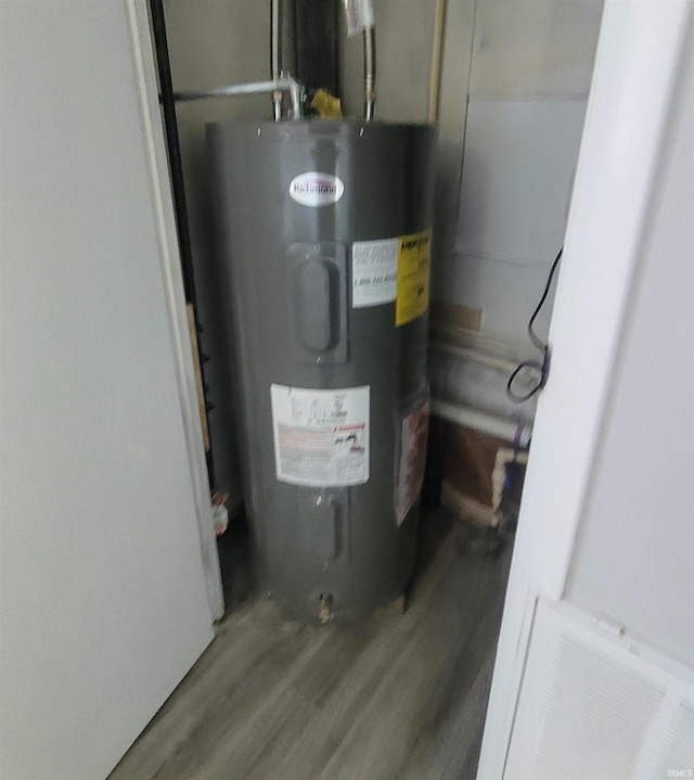 utility room featuring electric water heater